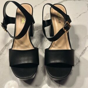 Black faux leather platform heels